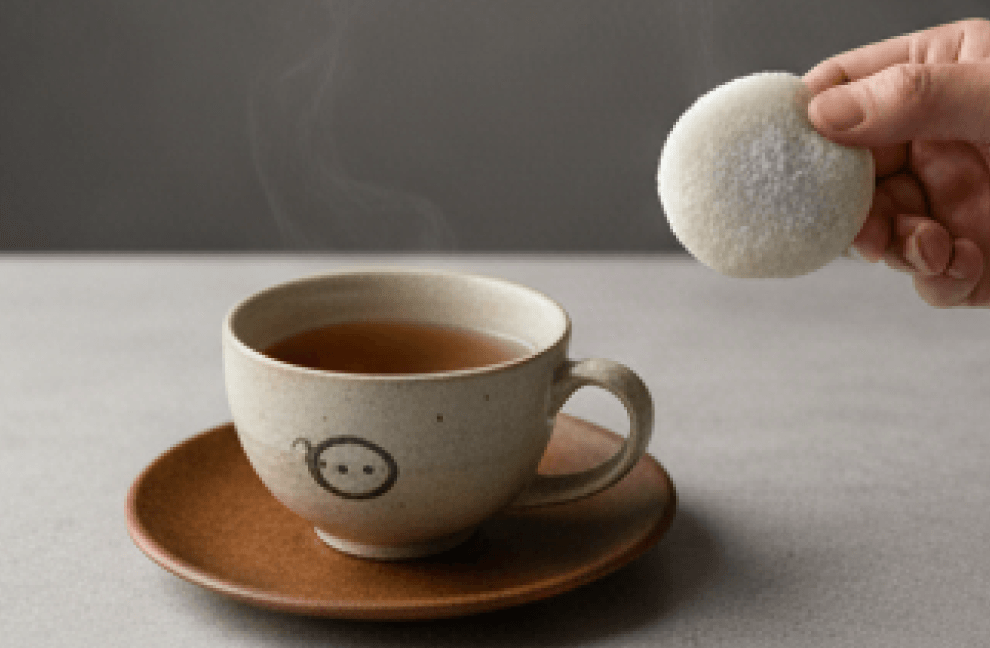 Enjoying mochi with tea